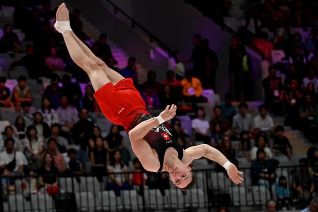 (251023) -- JAKARTA, Oct. 23, 2025 (Xinhua) -- Noe Seifert of Swiss competes on the floor exercise during the Men's All-Around Final of the 53rd FIG World Artistic Gymnastics Championships at Indonesia Arena Stadium in Jakarta, Indonesia, Oct. 22, 2025. (Xinhua/Agung Kuncahya B.)