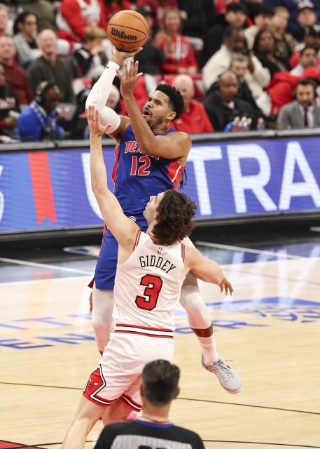 (251023) -- CHICAGO, Oct. 23, 2025 (Xinhua) -- Detroit Pistons' Tobias Harris (back) shoots the ball over Chicago Bulls' Josh Giddey during the NBA regular season basketball game between Detroit Pistons and Chicago Bulls at the United Center in Chicago, the United States, on Oct. 22, 2025. (Photo by Joel Lerner/Xinhua)