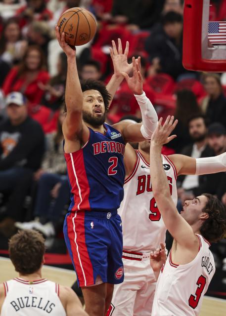 (251023) -- CHICAGO, Oct. 23, 2025 (Xinhua) -- Detroit Pistons' Cade Cunningham (L) shoots the ball during the NBA regular season basketball game between Detroit Pistons and Chicago Bulls at the United Center in Chicago, the United States, on Oct. 22, 2025. (Photo by Joel Lerner/Xinhua)