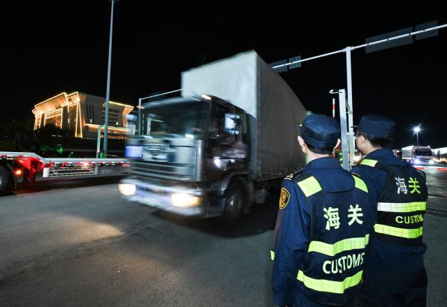 (251023) -- URUMQI, Oct. 23, 2025 (Xinhua) -- An outbound freight vehicle leaves the road port of Horgos, northwest China's Xinjiang Uygur Autonomous Region, Sept. 10, 2025. In the first three quarters of this year, the region's import and export value surged to 393.14 billion yuan (about 55.19 billion U.S. dollars), marking a 22.1 percent year on year increase, according to Urumqi Customs. (Xinhua/Li He)