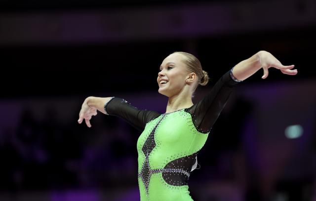 (251023) -- JAKARTA, Oct. 23, 2025 (Xinhua) -- Angelina Melnikova of AIN (Individual Neutral Athlete) competes during the Floor Exercise of the Women's All-Round Final at the 53rd FIG Artistic Gymnastics World Championships in Jakarta, Indonesia, on Oct. 23, 2025. (Xinhua/Bai Xuefei)