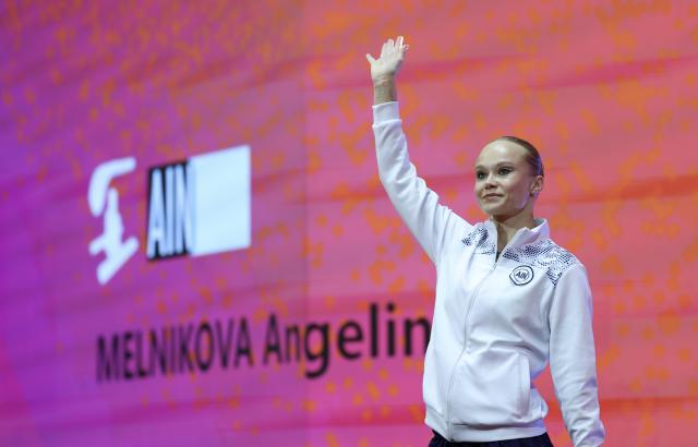 (251023) -- JAKARTA, Oct. 23, 2025 (Xinhua) -- Angelina Melnikova of AIN (Individual Neutral Athlete) gestures before the Women's All-Round Final at the 53rd FIG Artistic Gymnastics World Championships in Jakarta, Indonesia, on Oct. 23, 2025. (Xinhua/Bai Xuefei)