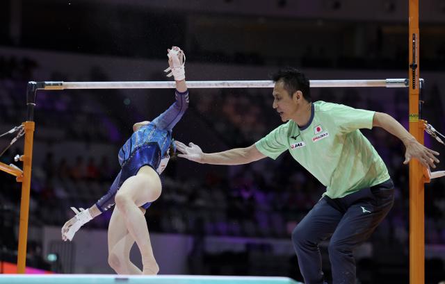 (251024) -- JAKARTA, Oct. 24, 2025 (Xinhua) -- Sugihara Aiko of Japan falls from uneven bars during the Uneven Bars of the Women's All-Round Final at the 53rd FIG Artistic Gymnastics World Championships in Jakarta, Indonesia, on Oct. 23, 2025. (Xinhua/Bai Xuefei)