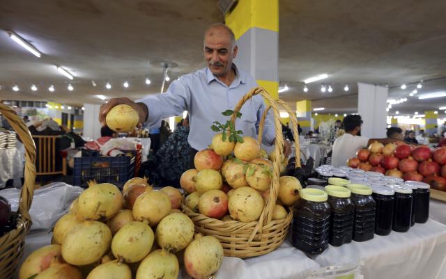 (251024) -- IRBID, Oct. 24, 2025 (Xinhua) -- This photo taken on Oct. 23, 2025 shows a booth at the 17th Annual Pomegranate and Rural Products Festival in Irbid, Jordan. The festival kicked off here on Thursday. (Photo by Mohammad Abu Ghosh/Xinhua)