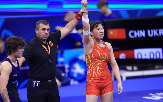 (251024) -- NOVI SAD, Oct. 24, 2025 (Xinhua) -- China's Rao Yuqi (R) celebrates victory against Ukraine's Oleksandra Rybak (L) after their semifinal match of the women's 65 kg category at the U23 Wrestling World Championships in Novi Sad, Serbia on Oct. 23, 2025. (Photo by Predrag Milosavljevic/Xinhua)