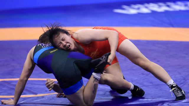 (251024) -- NOVI SAD, Oct. 24, 2025 (Xinhua) -- China's Rao Yuqi (R) and Ukraine's Oleksandra Rybak compete during their semifinal match of the women's 65 kg category at the U23 Wrestling World Championships in Novi Sad, Serbia on Oct. 23, 2025. (Photo by Predrag Milosavljevic/Xinhua)