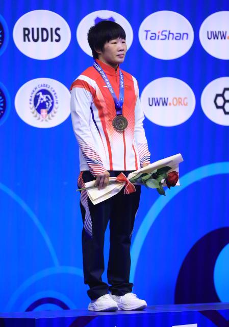 (251024) -- NOVI SAD, Oct. 24, 2025 (Xinhua) -- Gold medalist China's Liang Jinyue reacts during the awarding ceremony for women's 50 kg category at the U23 Wrestling World Championships in Novi Sad, Serbia on Oct. 23, 2025. (Photo by Predrag Milosavljevic/Xinhua)
