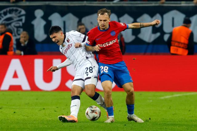 (251024) -- BUCHAREST, Oct. 24, 2025 (Xinhua) -- FCSB's Alexandru Pantea (R) vies with Bologna's Nicolo Cambiaghi during their UEFA Europa League football match in Bucharest, Romania, Oct. 23, 2025. (Photo by Cristian Cristel/Xinhua)