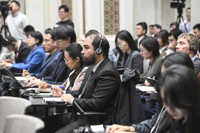 (251024) -- BEIJING, Oct. 24, 2025 (Xinhua) -- Journalists work at a press conference held by the Communist Party of China (CPC) Central Committee on the guiding principles from the fourth plenary session of the 20th CPC Central Committee on Oct. 24, 2025. (Xinhua/Jin Liangkuai)