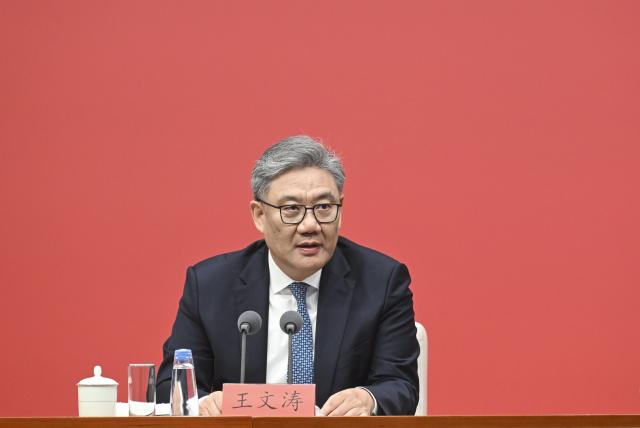 (251024) -- BEIJING, Oct. 24, 2025 (Xinhua) -- China's Commerce Minister Wang Wentao speaks at a press conference held by the Communist Party of China (CPC) Central Committee on the guiding principles from the fourth plenary session of the 20th CPC Central Committee on Oct. 24, 2025. (Xinhua/Jin Liangkuai)