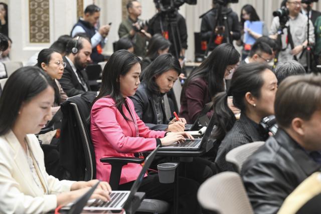 (251024) -- BEIJING, Oct. 24, 2025 (Xinhua) -- Journalists work at a press conference held by the Communist Party of China (CPC) Central Committee on the guiding principles from the fourth plenary session of the 20th CPC Central Committee on Oct. 24, 2025. (Xinhua/Jin Liangkuai)