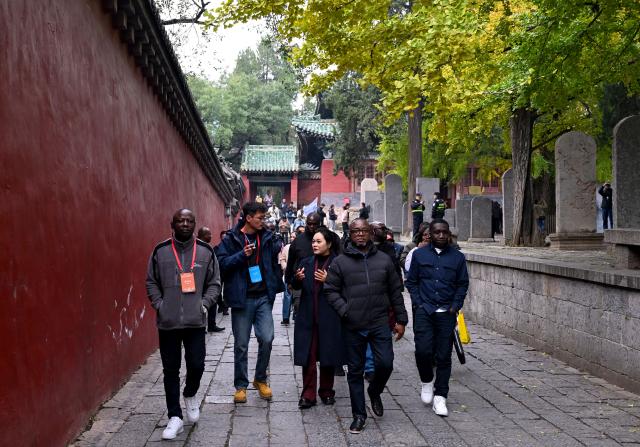 (251024) -- ZHENGZHOU, Oct. 24, 2025 (Xinhua) -- Guests visit Shaolin Temple scenic area in Dengfeng City, central China's Henan Province, Oct. 23, 2025. The Global Mayors Dialogue and the International Mayor's Forum on Tourism in Zhengzhou kicked off here on Friday. Guests attending the events had visited Henan Museum, Shaolin Temple and other places on Wednesday and Thursday to experience the charm of Henan. (Xinhua/Hao Yuan)