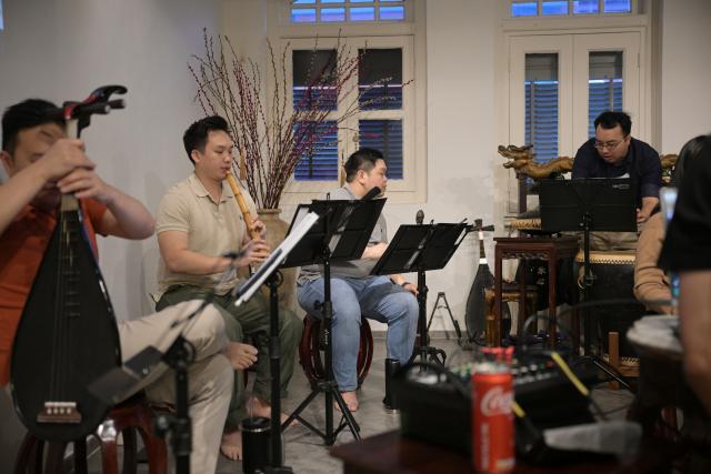 (251024) -- SINGAPORE, Oct. 24, 2025 (Xinhua) -- Members of a music society named Siong Leng rehearse Nanyin in Singapore on Jan. 8, 2025. Nanyin, which originated from southeast China's Fujian Province, is known as the "living fossil" of ancient Chinese music and literally means music in the south. It is a traditional opera in Fujian dialect.
In 2009, Nanyin was listed as a World Human Verbal and Intangible Cultural Heritage by UNESCO.
   The inheritance of Nanyin relies on dedicated practitioners. Cai Liyong, a Nanyin artist who started learning Nanyin since childhood, teaches Nanyin to students at a primary school in Jinjiang of Fujian Province every week, promoting authentic Nanyin among young students.
   In Singapore, a music society named Siong Leng is also dedicated to the preserving and promoting Nanyin. Established in 1941, Siong Leng made several successful performances in cities including Paris, Tokyo, and New York.
   From China to Singapore, from classrooms to the global stage, Nanyin weaves a continuous thread through cultural memories at home and abroad. (Photo by Then Chih Wey/Xinhua)