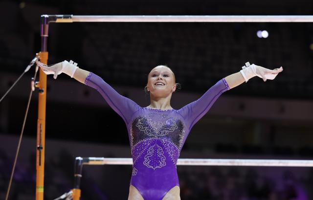(251024) -- JAKARTA, Oct. 24, 2025 (Xinhua) -- Angelina Melnikova of AIN (Individual Neutral Athlete) reacts during the Women's Uneven Bars Final at 53rd FIG Artistic Gymnastics World Championships in Jakarta, Indonesia, on Oct. 24, 2025. (Xinhua/Bai Xuefei)