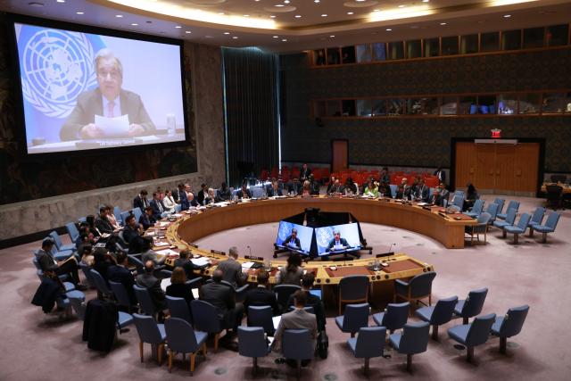 (251024) -- UNITED NATIONS, Oct. 24, 2025 (Xinhua) -- UN Secretary-General Antonio Guterres (on screens) speaks via a video link at an open debate of the Security Council on the future of the UN at the UN headquarters in New York, Oct. 24, 2025. Guterres called on the Security Council to channel the resources often spent on war to development and peace on Friday. (Xinhua/Xie E)