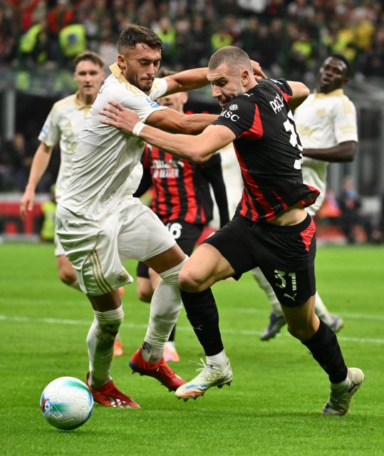 (251025) -- MILAN, Oct. 25, 2025 (Xinhua) -- AC Milan's Strahinja Pavlovic (R) vies with Pisa's Simone Canestrelli during a Serie A football match between AC Milan and Pisa in Milan, Italy, Oct. 24, 2025. (Photo by Alberto Lingria/Xinhua)