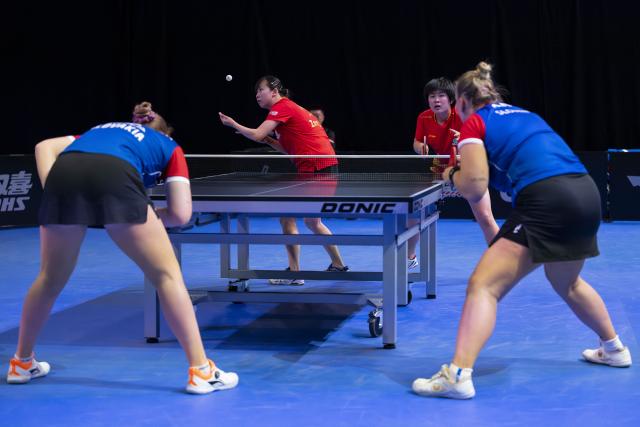 (251025) -- LONDON, Oct. 25, 2025 (Xinhua) -- Qin Yuxuan/Zong Geman (2nd L) of China compete during women's doubles quarterfinal against Barbora Varady and Tatiana Kukulkova of Slovakia in the WTT Star Contender London 2025 in London, Britain, on Oct. 24, 2025. (Photo by Stephen Chung/Xinhua)