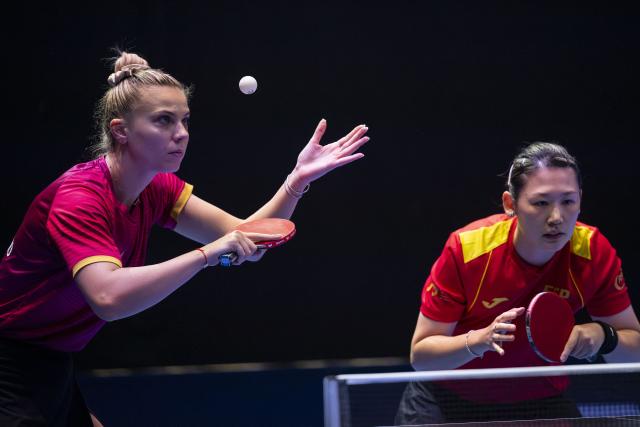(251025) -- LONDON, Oct. 25, 2025 (Xinhua) -- Adina Diaconu (L)/Maria Xiao compete during women's doubles quarterfinal between Shi Xunyao/Zhang Xiangyu of China and Adina Diaconu (Romania)/Maria Xiao (Spain) in the WTT Star Contender London 2025 in London, Britain, on Oct. 24, 2025. (Photo by Stephen Chung/Xinhua)