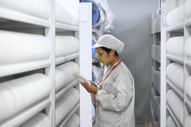 (251025) -- HUIZHOU, Oct. 25, 2025 (Xinhua) -- A staff member searches for information at a warehouse of Roborock in Huizhou, south China's Guangdong Province, Oct. 10, 2025. At a large shopping mall in Seoul, South Korea, a Chinese brand's robot vacuum cleaner attracted bustling crowds. A Roborock robot vacuum cleaner, equipped with a robotic arm, precisely picked up a sock, rotated, and threw it into a box, drawing cheers from the audience.
   According to data from a U.S. research firm, Roborock holds over 50 percent market share in South Korea's robot vacuum cleaner market, firmly securing the top position, with a dominance market share exceeding 70 percent in the high-end market. 
   Beyond South Korea, Roborock is rapidly expanding across other Asia-Pacific markets. In Japan, during a promotion on Amazon Japan, several Roborock products ranked among the most popular robot vacuum cleaners. In Australia, its products also made it into the top ten best-selling robot vacuum cleaner list.
   Over 2,000 kilometers away from South Korea, in Huizhou City of south China's Guangdong Province, Roborock's smart manufacturing facility operates at high efficiency, with robot vacuum cleaners continuously distributed worldwide.
   From workshops in China to living rooms across Asia-Pacific, Chinese brands for robot vacuum cleaners have gained popularity among foreign customers. (Xinhua/Deng Hua)