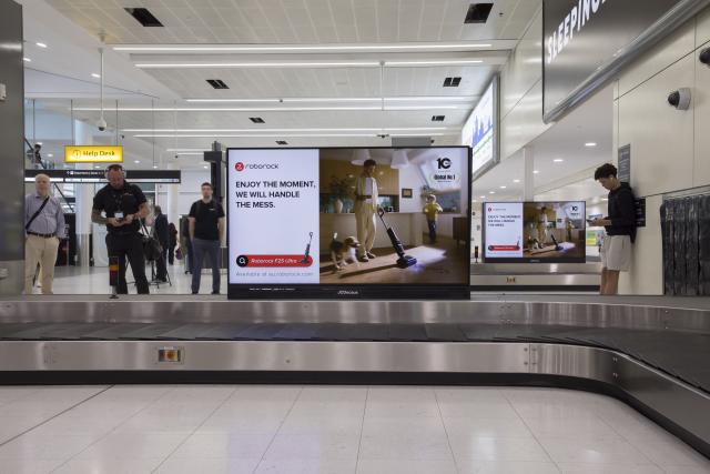 (251025) -- SYDNEY, Oct. 25, 2025 (Xinhua) -- This photo taken on Oct. 19, 2025 shows billboards of Roborock at Sydney Airport in Sydney, Australia. At a large shopping mall in Seoul, South Korea, a Chinese brand's robot vacuum cleaner attracted bustling crowds. A Roborock robot vacuum cleaner, equipped with a robotic arm, precisely picked up a sock, rotated, and threw it into a box, drawing cheers from the audience.
   According to data from a U.S. research firm, Roborock holds over 50 percent market share in South Korea's robot vacuum cleaner market, firmly securing the top position, with a dominance market share exceeding 70 percent in the high-end market. 
   Beyond South Korea, Roborock is rapidly expanding across other Asia-Pacific markets. In Japan, during a promotion on Amazon Japan, several Roborock products ranked among the most popular robot vacuum cleaners. In Australia, its products also made it into the top ten best-selling robot vacuum cleaner list.
   Over 2,000 kilometers away from South Korea, in Huizhou City of south China's Guangdong Province, Roborock's smart manufacturing facility operates at high efficiency, with robot vacuum cleaners continuously distributed worldwide.
   From workshops in China to living rooms across Asia-Pacific, Chinese brands for robot vacuum cleaners have gained popularity among foreign customers. (Roborock/Handout via Xinhua)