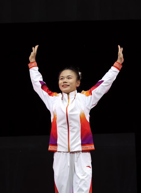 (251025) -- JAKARTA, Oct. 25, 2025 (Xinhua) -- Gold medalist Zhang Qingying of China celebrates during the awarding ceremony for the women's balance beam at 53rd FIG Artistic Gymnastics World Championships in Jakarta, Indonesia, on Oct. 25, 2025. (Xinhua/Bai Xuefei)