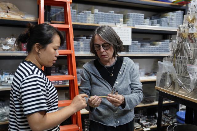 (251025) -- JINGDEZHEN, Oct. 25, 2025 (Xinhua) -- Christiane Toewe (R) selects tools for ceramics at a store in Jingdezhen City, east China's Jiangxi Province, Oct. 19, 2025.
  Christiane Toewe, a German ceramic artist, joined a residency program in the "porcelain capital" of Jingdezhen for the third time. During her stay, she shared her techniques and ideas with local and international artists, and also drew inspiration from the city with a ceramic history spanning more than 2,000 years.
   "In Jingdezhen, artists are able to acquire the best materials and work with skilled kiln masters," Toewe said. "The city is like a treasure box where you can find everything you want."
   Toewe's experience living and working in Jingdezhen made her feel at home. Before the end of her stay, her husband also came to Jingdezhen, helping with her work and enjoying the city's cultural atmosphere. Toewe said that although Jingdezhen was far from her home country, she felt a sense of belonging as everyone there had a shared love for ceramics. (Xinhua/Zhou Mi)