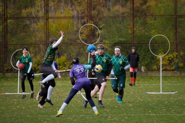 (251026) -- WARSAW, Oct. 26, 2025 (Xinhua) -- Players compete during the Polish qualifiers for the European Quadball Cup in Warsaw, Poland, Oct. 25, 2025. Quadball, originally inspired by Quidditch in the 'Harry Potter' series, combines elements of rugby, handball, water polo and dodgeball. (Photo by Jaap Arriens/Xinhua)