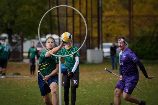 (251026) -- WARSAW, Oct. 26, 2025 (Xinhua) -- A player shoots the ball toward the hoop during the Polish qualifiers for the European Quadball Cup in Warsaw, Poland, Oct. 25, 2025. Quadball, originally inspired by Quidditch in the 'Harry Potter' series, combines elements of rugby, handball, water polo and dodgeball. (Photo by Jaap Arriens/Xinhua)