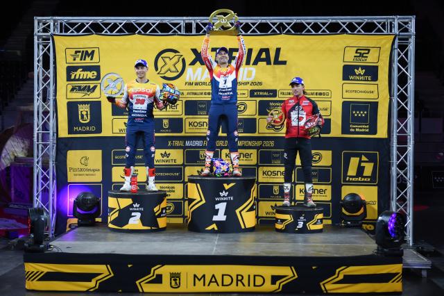 (251026) -- MADRID, Oct. 26, 2025 (Xinhua) -- First-placed Toni Bou(C) of Spain, second-placed Gabriel Marcelli(L) of Spain and third-placed Jaime Busto of Spain pose for photo during the awarding ceremony for the 2025-2026 FIM X-Trial World Championship, at Madrid Arena Stadium, Madrid, Spain, on Oct 25, 2025. (Photo by Gustavo Valiente/Xinhua)