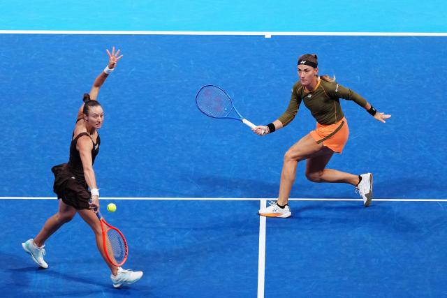 (251026) -- TOKYO, Oct. 26, 2025 (Xinhua) -- Timea Babos (Hungary) / Luisa Stefani (L, Brazil) compete during the women's doubles final match between Timea Babos (Hungary) / Luisa Stefani (Brazil) and Anna Danilina (Kazakhstan) / Aleksandra Krunic (Serbia) at the Pan Pacific Open tennis tournament in Tokyo, Japan, on Oct. 26, 2025. (Xinhua/Jia Haocheng)