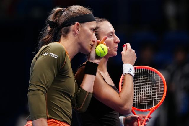 (251026) -- TOKYO, Oct. 26, 2025 (Xinhua) -- Timea Babos (L, Hungary) / Luisa Stefani (Brazil) react during the women's doubles final match between Timea Babos (Hungary) / Luisa Stefani (Brazil) and Anna Danilina (Kazakhstan) / Aleksandra Krunic (Serbia) at the Pan Pacific Open tennis tournament in Tokyo, Japan, on Oct. 26, 2025. (Xinhua/Jia Haocheng)
