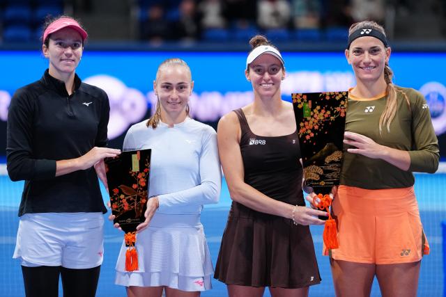 (251026) -- TOKYO, Oct. 26, 2025 (Xinhua) -- Timea Babos (1st R) of Hungary / Luisa Stefani (2nd R) of Brazil and Anna Danilina (1st L) of Kazakhstan / Aleksandra Krunic of Serbia react during the awarding ceremony after their women's doubles final match at the Pan Pacific Open tennis tournament in Tokyo, Japan, on Oct. 26, 2025. (Xinhua/Jia Haocheng)