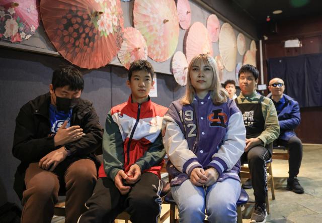 (251026) -- BEIJING, Oct. 26, 2025 (Xinhua) -- Visually impaired people and volunteers watch a movie with audio description at Trojan Fairy restaurant in Beijing, capital of China, Oct. 26, 2025. The Trojan Fairy restaurant, which focuses on supporting people with disabilities, hosted a film screening for 52 visually and physically impaired attendees. The event featured narrated audio descriptions to help visually impaired participants visualize scenes. (Xinhua/Yin Gang)