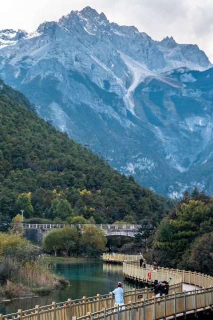 (251026) -- LIJIANG, Oct. 26, 2025 (Xinhua) -- Tourists visit the Lanyue (Blue Moon) Valley in Lijiang City, southwest China's Yunnan Province, Oct. 26, 2025. (Xinhua/Hu Chao)