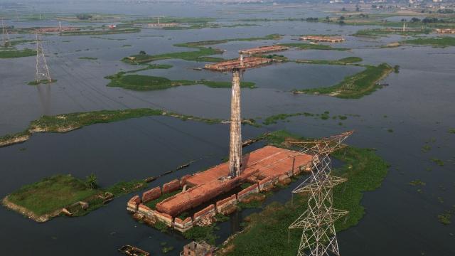(251026) -- DHAKA, Oct. 26, 2025 (Xinhua) -- An aerial drone photo taken on Oct. 25, 2025 shows some brickyards half submerged in floodwater in Dhaka, Bangladesh. Heavy rainfall and rising river levels have submerged low-lying areas around the capital including some brickyards. (Photo by Habibur Rahman/Xinhua)