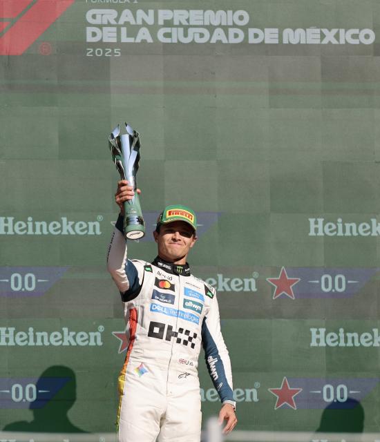 (251027) -- MEXICO CITY, Oct. 27, 2025 (Xinhua) -- First-placed McLaren's British driver Lando Norris attends the awarding ceremony for the Formula One Mexico Grand Prix at the Hermanos Rodriguez Circuit in Mexico City, Mexico, Oct. 26, 2025. (Xinhua/Li Mengxin)