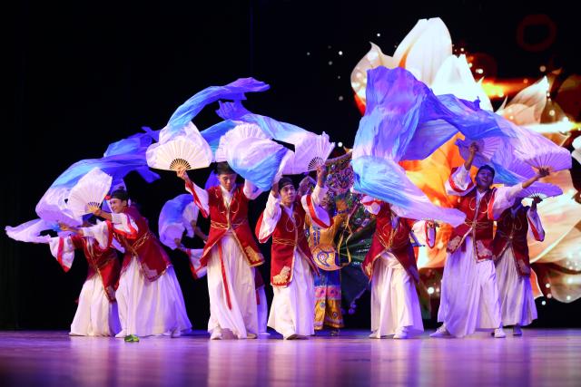 (251027) -- YANGON, Oct. 27, 2025 (Xinhua) -- Artists perform during the grand finals and award ceremony of Myanmar's Chinese song competition at the National Theater in Yangon, Myanmar, Oct. 26, 2025. TO GO WITH "Feature: Melodies of friendship -- Chinese song contest strengthens cultural bonds in Yangon" (Xinhua/Myo Kyaw Soe)