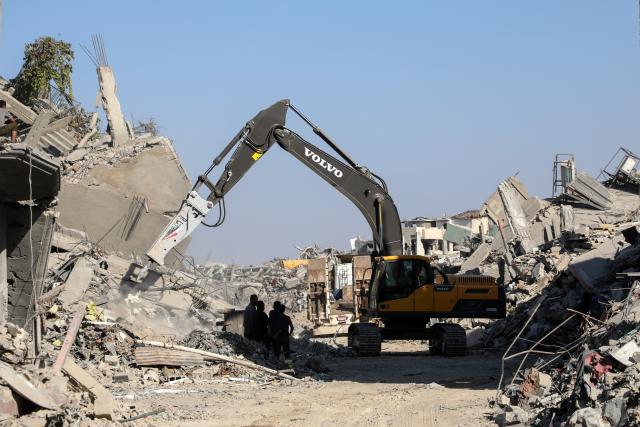 (251027) -- GAZA, Oct. 27, 2025 (Xinhua) -- An Egyptian Excavator works at al-Tuffah area east of Gaza City, Oct. 27, 2025. Red Cross and Egyptian teams have been allowed to enter the Gaza Strip to search for the bodies of hostages, Israeli government spokesperson Shosh Bedrosian said on Sunday. (Photo by Rizek Abdeljawad/Xinhua)