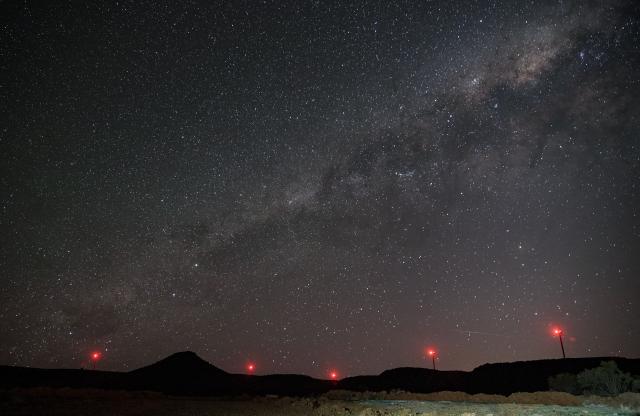 (251028) -- DE AAR, Oct. 28, 2025 (Xinhua) -- Beacon lights on wind turbines of the De Aar Wind Power Project are seen under the starry sky in De Aar, Northern Cape, South Africa, Oct. 22, 2025.
  To bolster Africa's green development, China has assisted countries in constructing several clean energy projects.
  The De Aar Wind Farm has changed South Africa's energy landscape. As the first wind power project financed, constructed and operated by a Chinese company in Africa, it supplies 760 million kilowatt-hours of clean electricity annually, meeting the electricity needs of 300,000 households. The farm has contributed to closing the gap caused by unstable clean energy and addressing the electricity shortage in South Africa. (Xinhua/Han Xu)