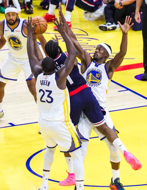 (251029) -- SAN FRANCISCO, Oct. 29, 2025 (Xinhua) -- Jimmy Butler III (1st R) and Draymond Green (front L) of Golden State Warriors defend James Harden of Los Angeles Clippers during the 2025-2026 NBA regular season match between Golden State Warriors and Los Angeles Clippers in San Francisco, the United States, on Oct. 28, 2025. (Photo by Arthur Dong/Xinhua)