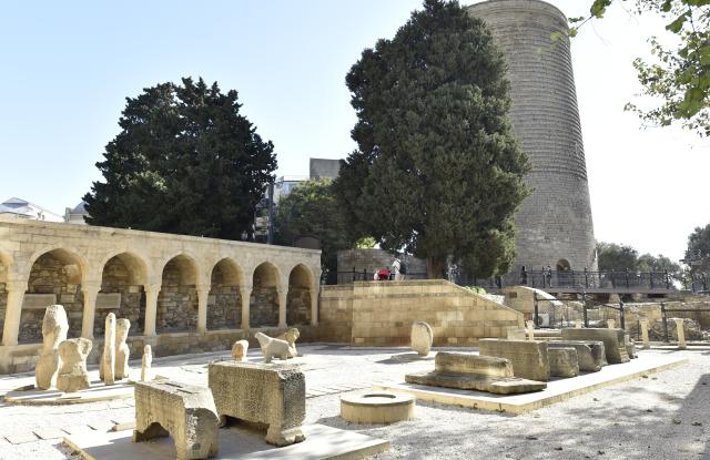 (251029) -- BAKU, Oct. 29, 2025 (Xinhua) -- This photo taken on Oct. 28, 2025 shows a view of an open-air archaeological exhibition in front of the Maiden Tower, in Baku's Old City, Azerbaijan. The Old City, the historical core of Baku, is a UNESCO World Heritage Site. (Xinhua/Chen Junfeng)