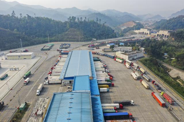 (251029) -- NANNING, Oct. 29, 2025 (Xinhua) -- An aerial drone photo taken on March 21, 2025 shows trucks loaded with agricultural products from China and ASEAN countries at the Friendship Pass Port in Pingxiang, south China's Guangxi Zhuang Autonomous Region. (Xinhua/Cao Yiming)