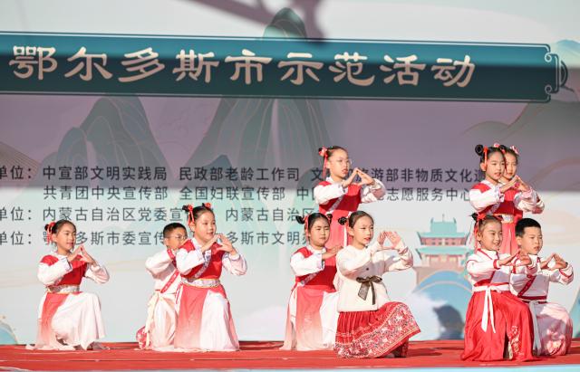(251029) -- ERDOS, Oct. 29, 2025 (Xinhua) -- Children perform during an event to mark the Chongyang Festival in Erdos, north China's Inner Mongolia Autonomous Region, Oct. 29, 2025. The Double Ninth Festival, also known as the Chongyang Festival, celebrated on the ninth day of the ninth lunar month, falls on Wednesday this year. It is an occasion to care for and send blessings to older people in China. (Xinhua/Bei He)
