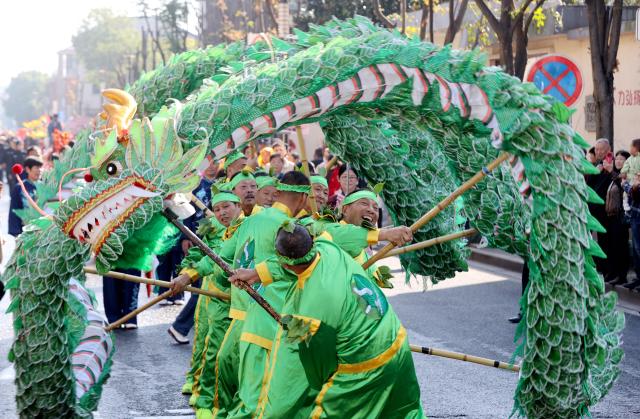 (251029) -- BEIJING, Oct. 29, 2025 (Xinhua) -- Fork artists stage an intangible cultural heritage performance of dragon dance to celebrate Chongyang Festival in Deqing County of Huzhou City, east China's Zhejiang Province, Oct. 29, 2025. A series of celebration activities were held across the country to mark Chongyang Festival, which falls on Oct. 29 this year. Also known as China's Seniors' Day, it honors the country's traditional virtues of filial piety and family love. (Photo by Xie Shangguo/Xinhua)