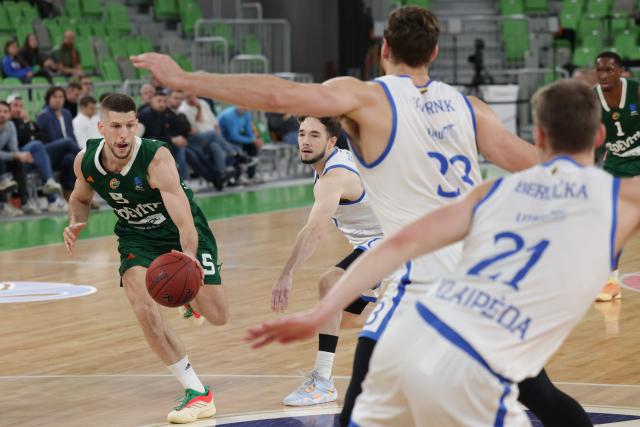 (251030) -- LJUBLJANA, Oct. 30, 2025 (Xinhua) -- Aleksej Nikolic (1st L) of Cedevita Olimpija breaks through during the BKT EuroCup 2025/26 round 5 group A between Cedevita Olimpija and Neptunas Klaipeda in Ljubljana, Slovenia, Oct. 29, 2025. (Photo by Zeljko Stevanic/Xinhua)