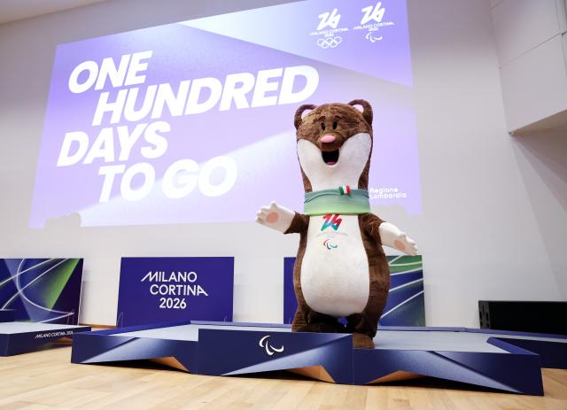 (251030) -- MILAN, Oct. 30, 2025 (Xinhua) -- Milano-Cortina 2026 Paralympic Games mascot Milo is pictured standing on the newly unveiled podiums for Milano-Cortina 2026 Paralympic Games during a ceremony marking 100 days to the opening of the Milano-Cortina 2026 Olympic Winter Games at Palazzo Lombardia in Milan, Italy, Oct. 29, 2025. 
A ceremony marking 100 days to the opening of the Milano-Cortina 2026 Olympic Winter Games was held at Palazzo Lombardia in Milan, where organizers unveiled the official podiums for the Olympic and Paralympic Games and introduced 12 "digital torchbearers", symbolizing the start of the final stage of preparations for the event. (Xinhua/Li Jing)