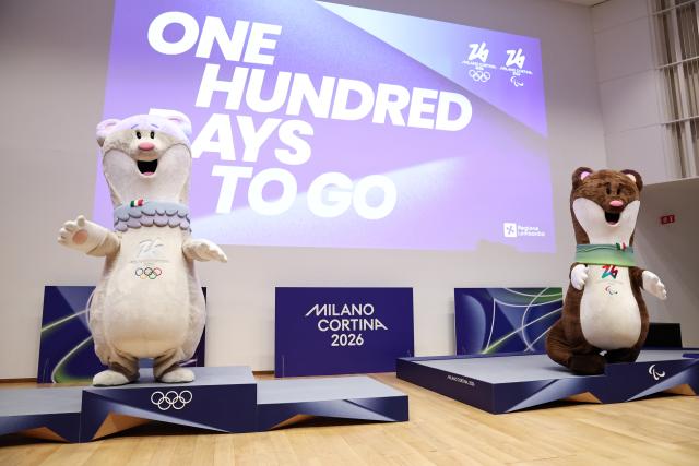 (251030) -- MILAN, Oct. 30, 2025 (Xinhua) -- The Mascots Tina (L) and Milo are pictured standing on the newly unveiled podiums for Milano-Cortina 2026 Olympic and Paralympic Games during a ceremony marking 100 days to the opening of the Milano-Cortina 2026 Olympic Winter Games at Palazzo Lombardia in Milan, Italy, Oct. 29, 2025. 
A ceremony marking 100 days to the opening of the Milano-Cortina 2026 Olympic Winter Games was held at Palazzo Lombardia in Milan, where organizers unveiled the official podiums for the Olympic and Paralympic Games and introduced 12 "digital torchbearers", symbolizing the start of the final stage of preparations for the event. (Xinhua/Li Jing)