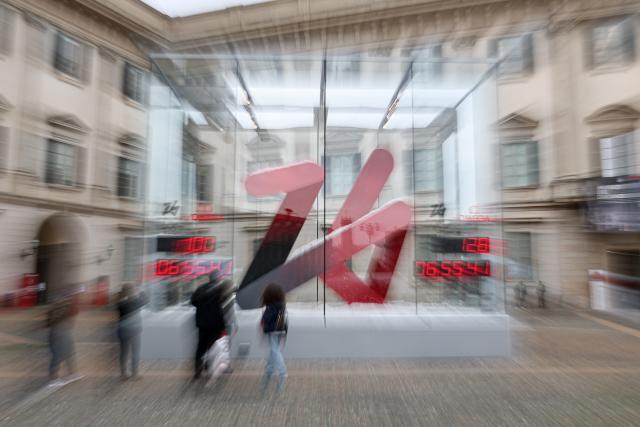 (251030) -- MILAN, Oct. 30, 2025 (Xinhua) -- This photo taken on Oct. 29, 2025 shows the digital countdown timer of Milano-Cortina 2026 Olympic and Paralympic Games in Milan, Italy. A ceremony marking 100 days to the opening of the Milano-Cortina 2026 Olympic Winter Games was held at Palazzo Lombardia in Milan, where organizers unveiled the official podiums for the Olympic and Paralympic Games and introduced 12 "digital torchbearers", symbolizing the start of the final stage of preparations for the event. (Xinhua/Li Jing)