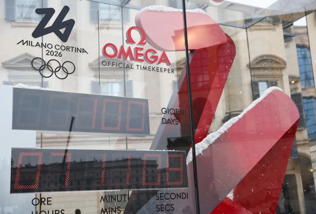 (251030) -- MILAN, Oct. 30, 2025 (Xinhua) -- This photo taken on Oct. 29, 2025 shows the digital countdown timer of Milano-Cortina 2026 Olympic Games in Milan, Italy. A ceremony marking 100 days to the opening of the Milano-Cortina 2026 Olympic Winter Games was held at Palazzo Lombardia in Milan, where organizers unveiled the official podiums for the Olympic and Paralympic Games and introduced 12 "digital torchbearers", symbolizing the start of the final stage of preparations for the event. (Xinhua/Li Jing)