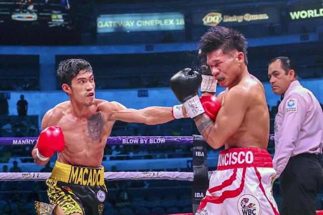 (251030) -- QUEZON CITY, Oct. 30, 2025 (Xinhua) -- Ramel Macado Jr. (L) of the Philippines competes against Albert Francisco of the Philippines during the flyweight match at the Thrilla in Manila 50th Anniversary in Quezon City, the Philippines on Oct. 29, 2025. (Xinhua/Rouelle Umali)